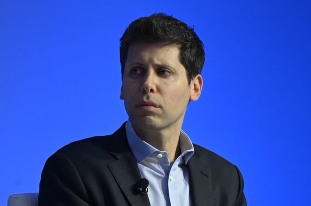 OpenAI CEO Sam Altman at tech event.