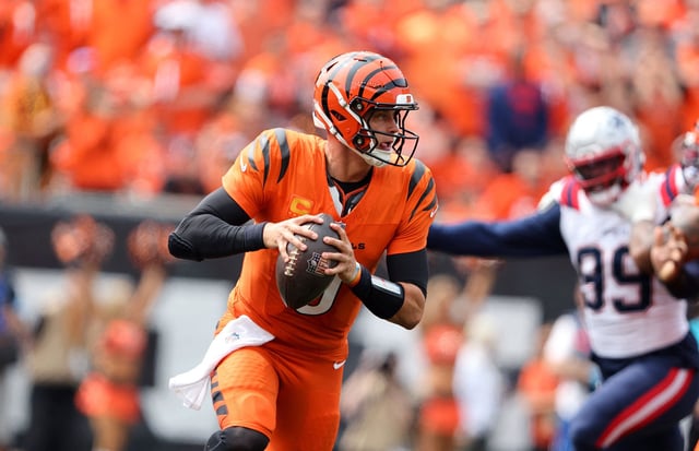 Joe Burrow runs the ball during the first quarter of the Cincinnati Bengals' game against the New England Patriots.
