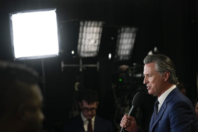 California Gov. Gavin Newsom speaks to reporters in the spin room before a presidential debate between Republican presidential nominee former President Donald Trump and Democratic presidential nominee Vice President Kamala Harris in Philadelphia, Pennsylvania, on Tuesday. (Matt Rourke - File /AP)