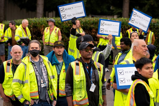 Boeing factory workers hold signs as they wait to vote on their first full contract in 16 years, at an International Association of Machinists and Aerospace Workers District 751 union hall, in Renton, Washington, U.S. September 12, 2024.  REUTERS/David Ryder