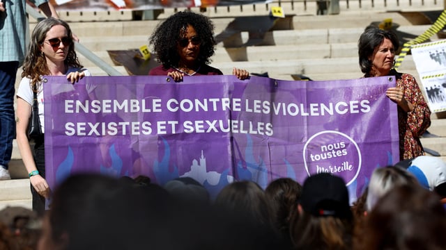 Women hold a banner that reads: "Together against gender-based and sexual violence", during a demonstration in support of Gisele Pelicot, who was allegedly drugged and raped by men solicited by her husband Dominique Pelicot, and of all rape victims, as the trial continues, near the courthouse in Marseille, France, September 14, 2024. REUTERS/Manon Cruz