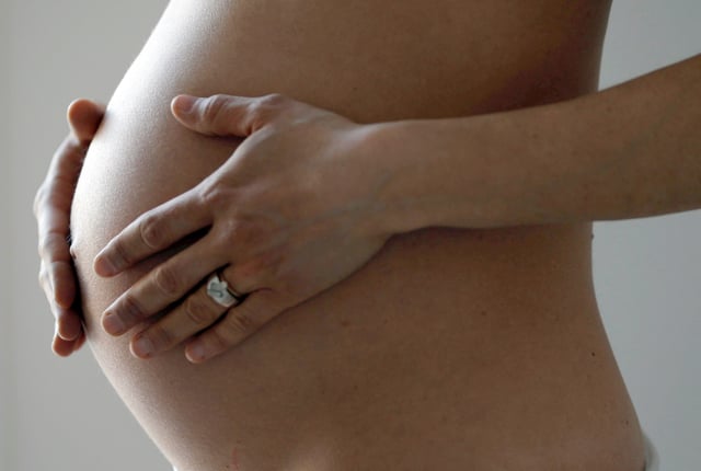 A pregnant woman, in the last trimester of her pregnancy, poses in this illustration photo in Sete, South France, March 26, 2016. REUTERS/Regis Duvignau/File Photo