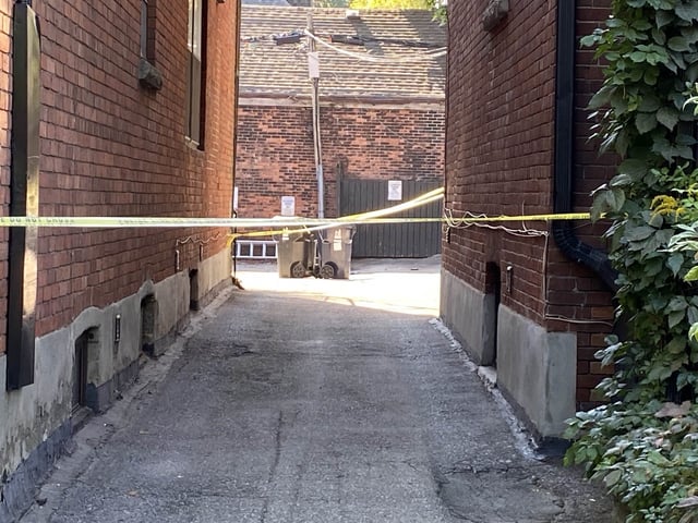 The scene where a Toronto police officer suffered cuts from a broken window that required surgery.