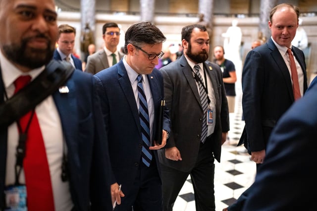 House Speaker Mike Johnson walks from his office to the house floor at the US Capitol on September 12 in Washington, DC.