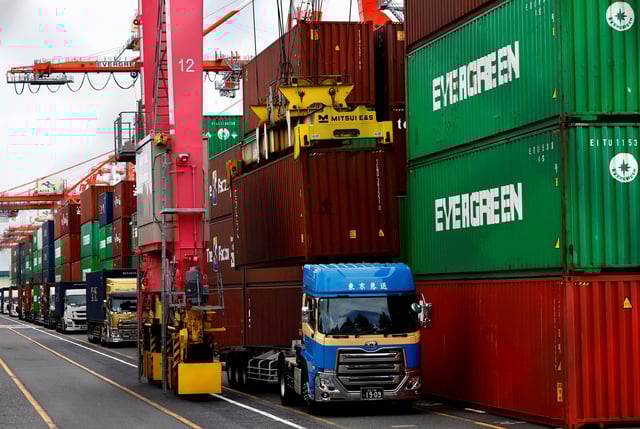 Stacked containers are seen at an industrial port in Tokyo, Japan February 15, 2024.  REUTERS/Issei Kato/File Photo