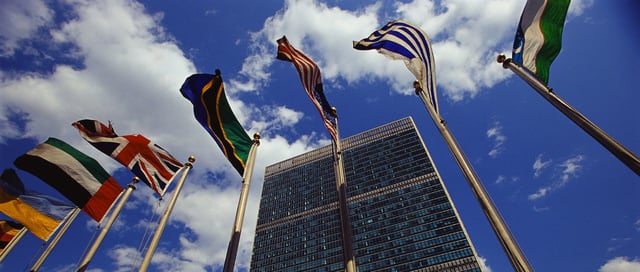 Flags fly outside the General Secretariat Building at the United Nations Headquarters.