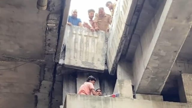 As a crane was brought to the site, the men lifted her and assisted the team in getting her into the crane for her descent on Saturday.
