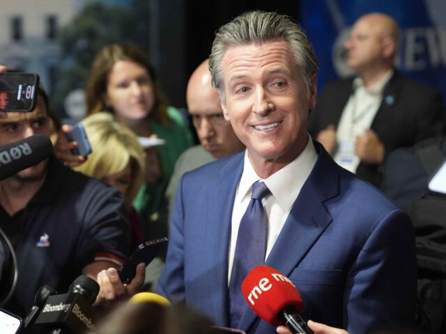 California Gov. Gavin Newsom speaks to reporters in the spin room before a presidential debate between Republican presidential nominee former President Donald Trump and Democratic presidential nominee Vice President Kamala Harris, Tuesday, Sept. 10, 2024, in Philadelphia. (AP Photo/Matt Rourke)