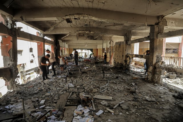 Palestinians inspect the damage to a school sheltering displaced people after it was hit by an Israeli strike, amid the Israel-Hamas conflict, at Beach refugee camp in Gaza City, September 22, 2024. REUTERS/Dawoud Abu Alkas/File Photo
