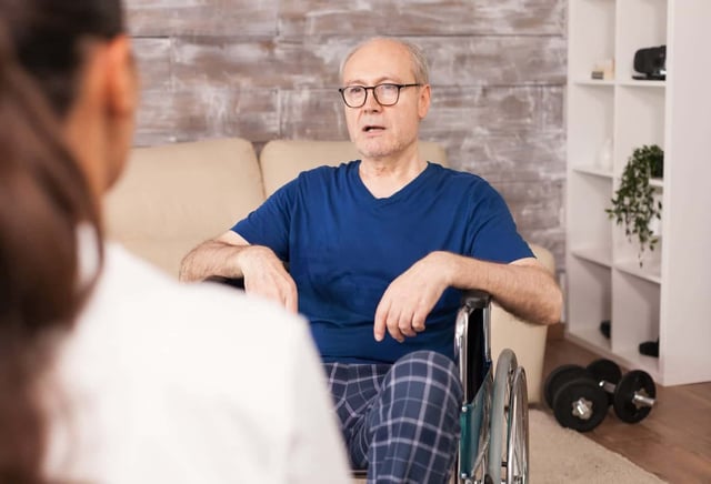 Image showing Elderly man with disabilities consulted at home by nurse. Related tags.